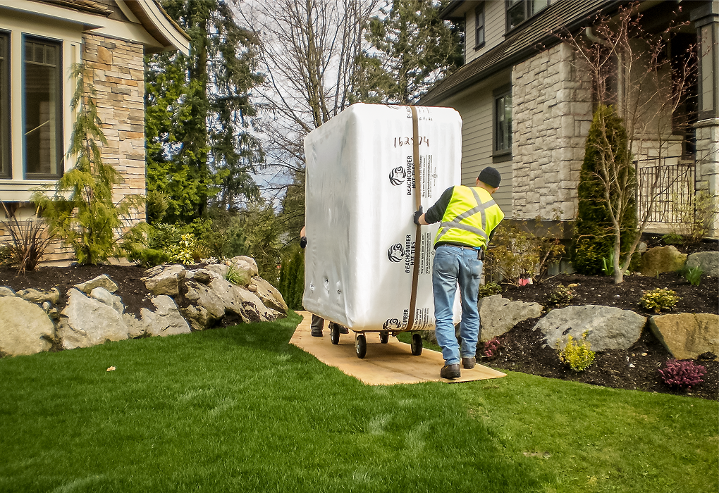 Hot tub technician repairing unit