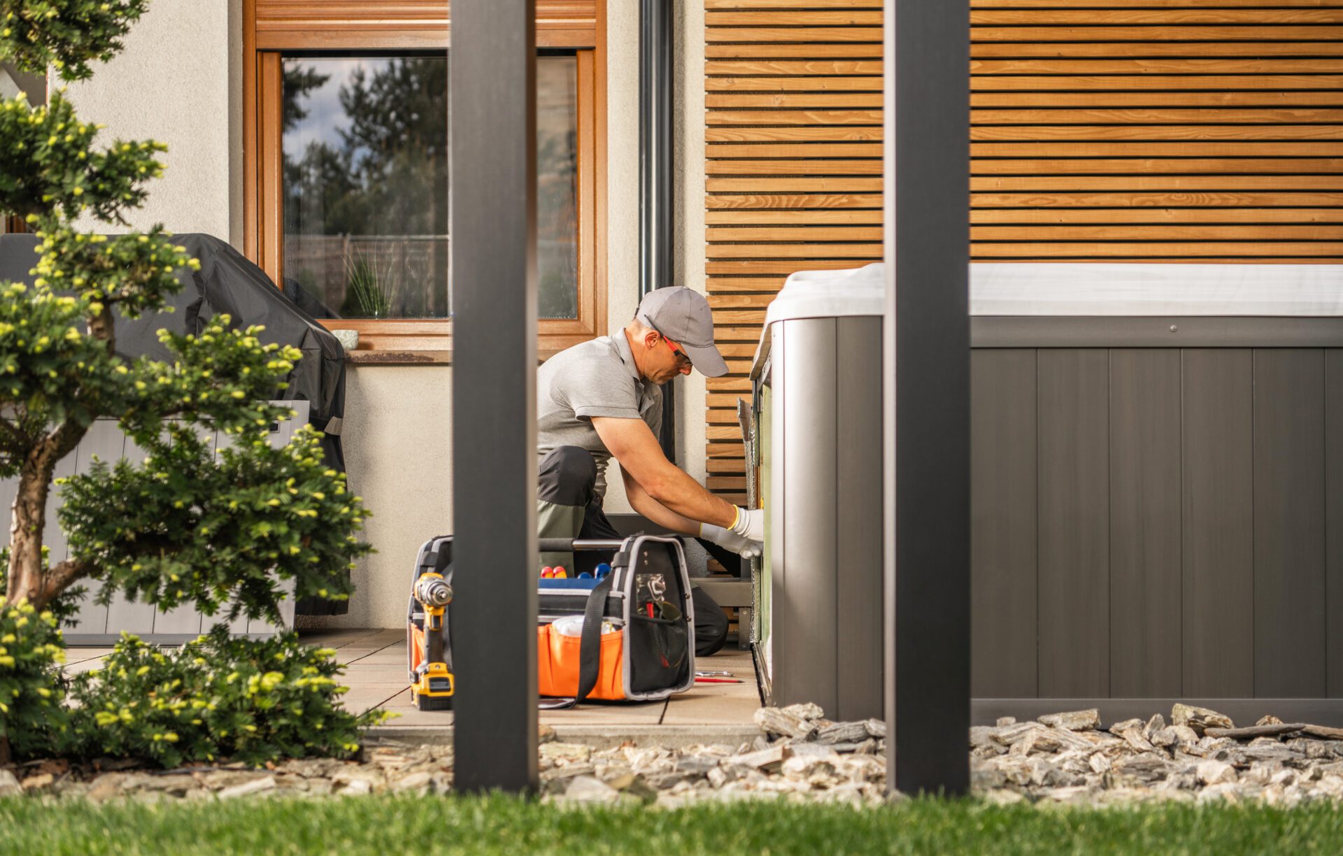 Hot tub technician repairing unit
